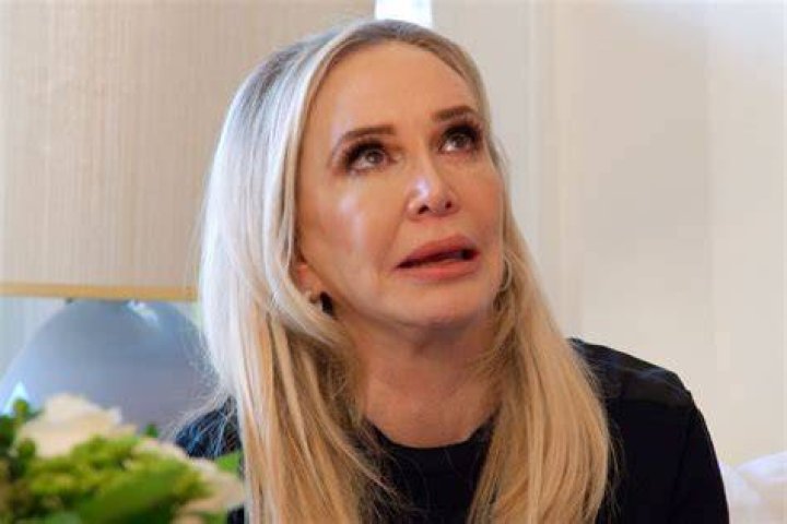 Shannon Beador rubbing the tears off her face.